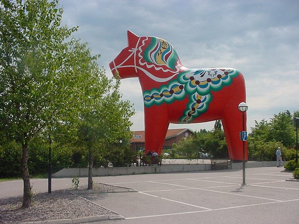 'Mother of' all Dala horses, in Avesta, Dalarna.  See the little people at the horse's feet.